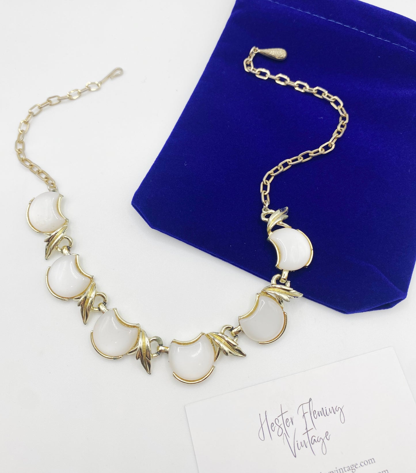 Vintage 1940s Coro Necklace Flatlay with HFV pouch and card.
