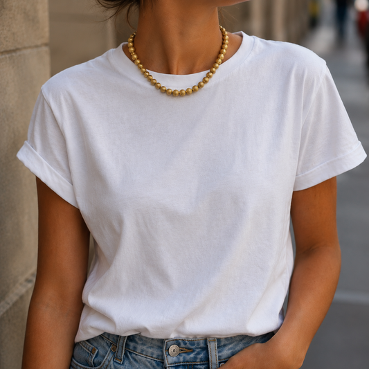 1950s Trifari necklace, worn by a model wearing a white tee and jeans.