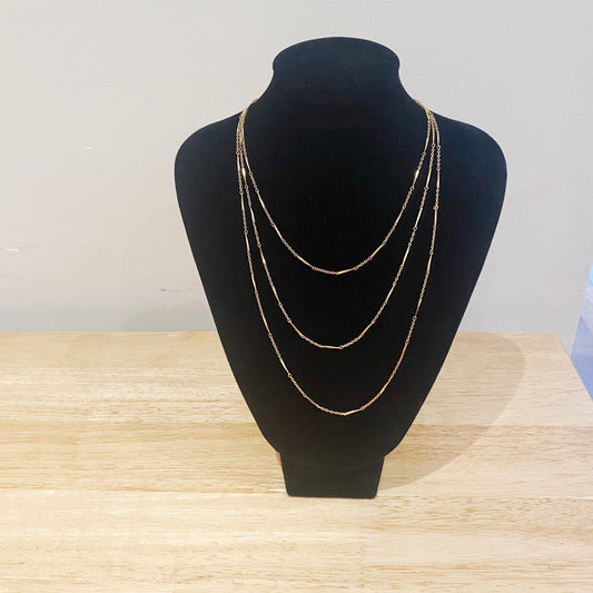 1970s Trifari goldtone triple chain necklace – front view, layered design.