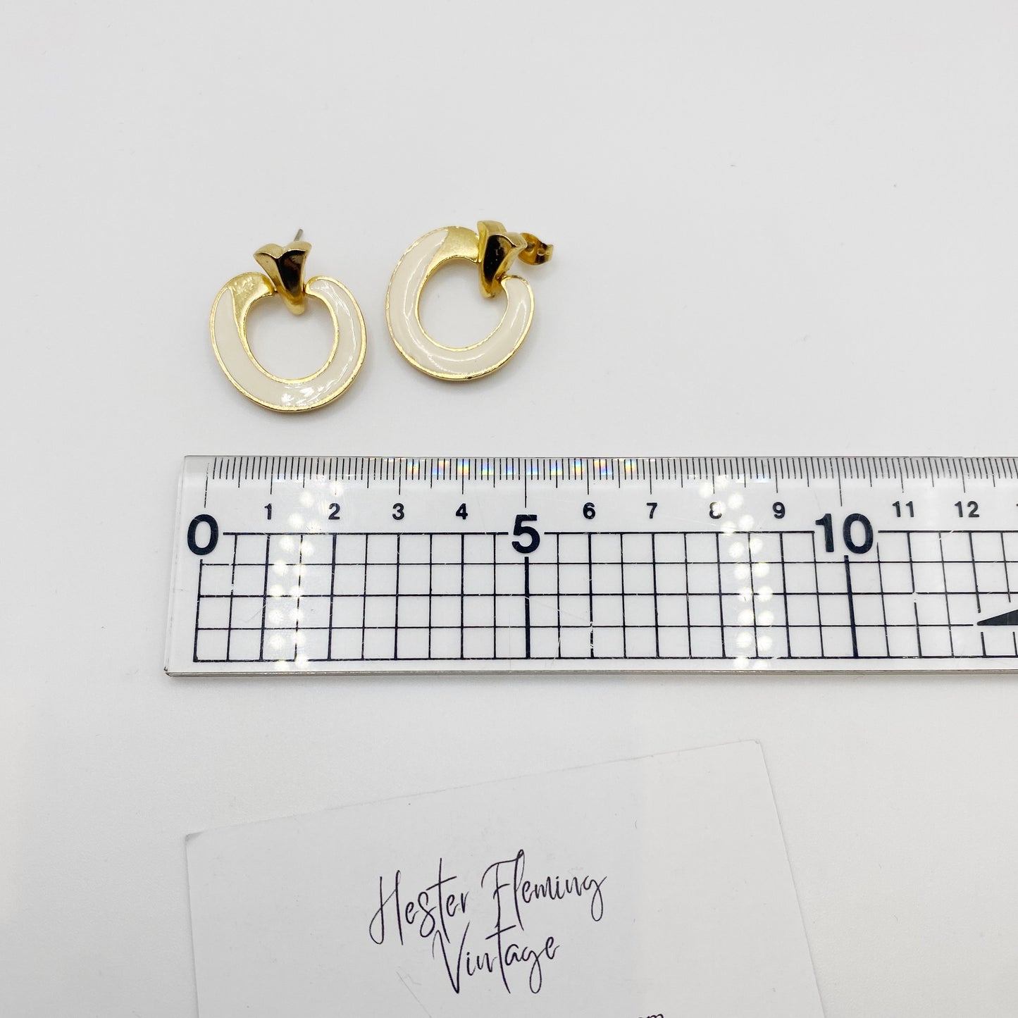 Measurement of 1970s vintage cream enamel and 22kt gold plated earrings for pierced ears