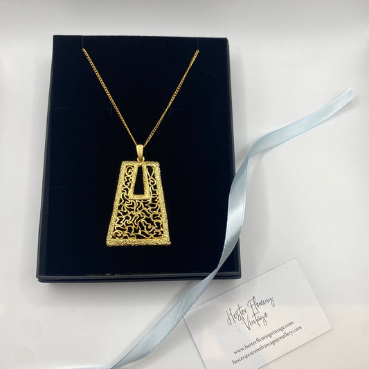 1970s vintage pendant with modernist filigree design and 22kt gold plating.