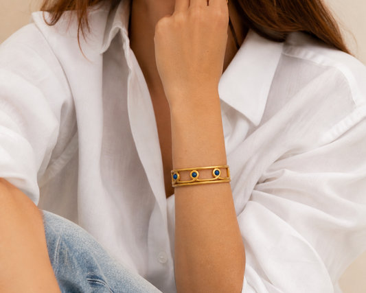 1980s Monet Bangle, styled on a model wearing a white shirt.