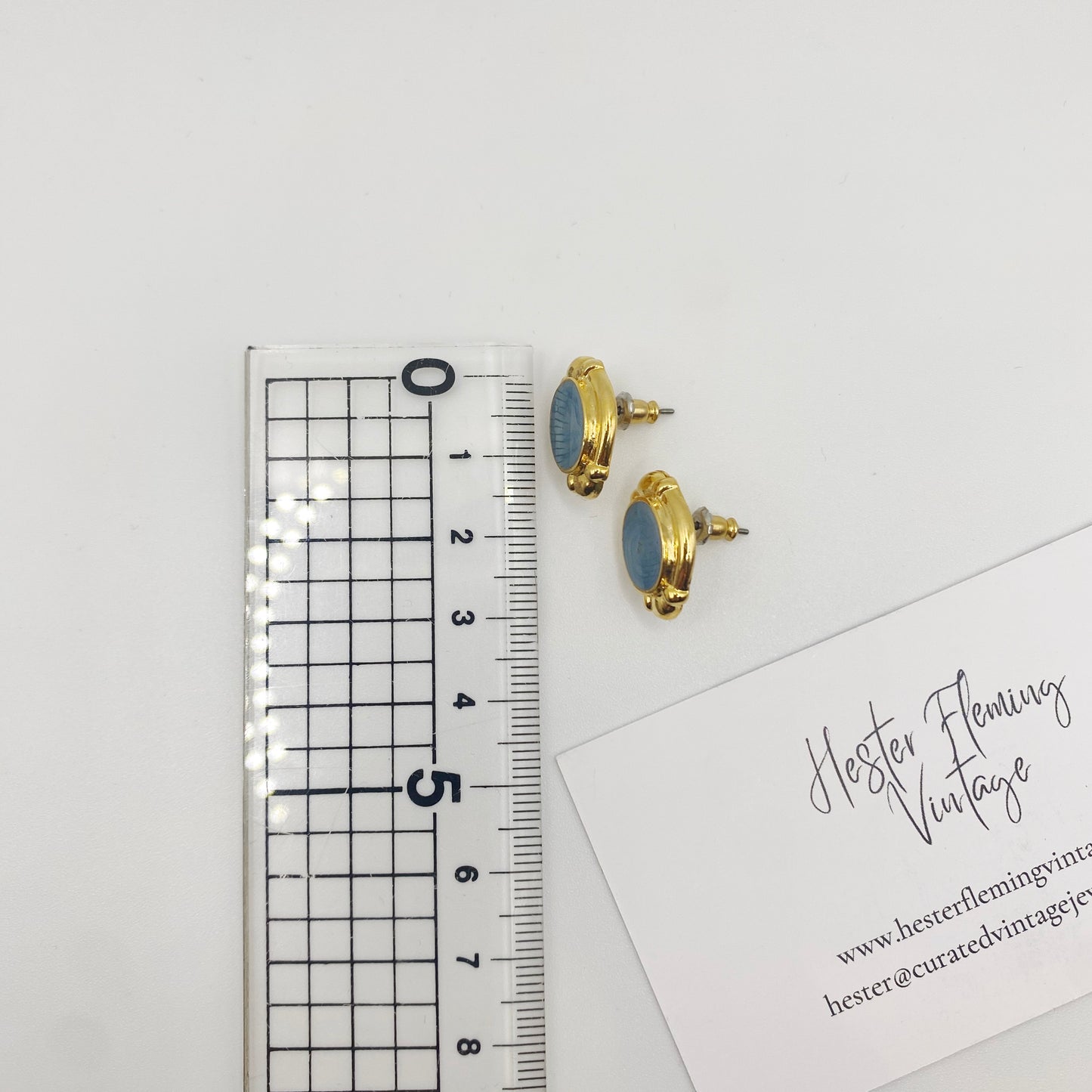 Measurement of vintage blue enamel and gold stud earrings, deadstock from London, 90s era.
