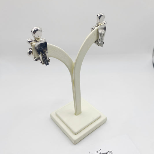 Clip on fitting for 1950s Weiss earrings, on jewellery stand.