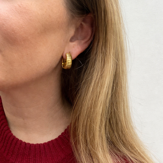 Vintage 1990s Christian Dior Clip on earrings, styled on a model.