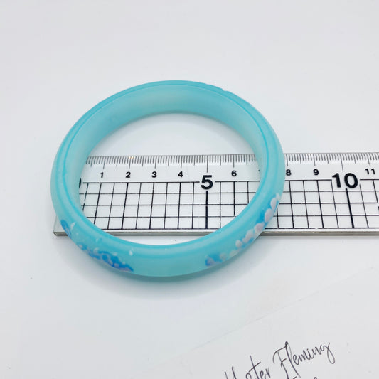 6.75cm diameter of blue polymer bangle, dating from the 80s.