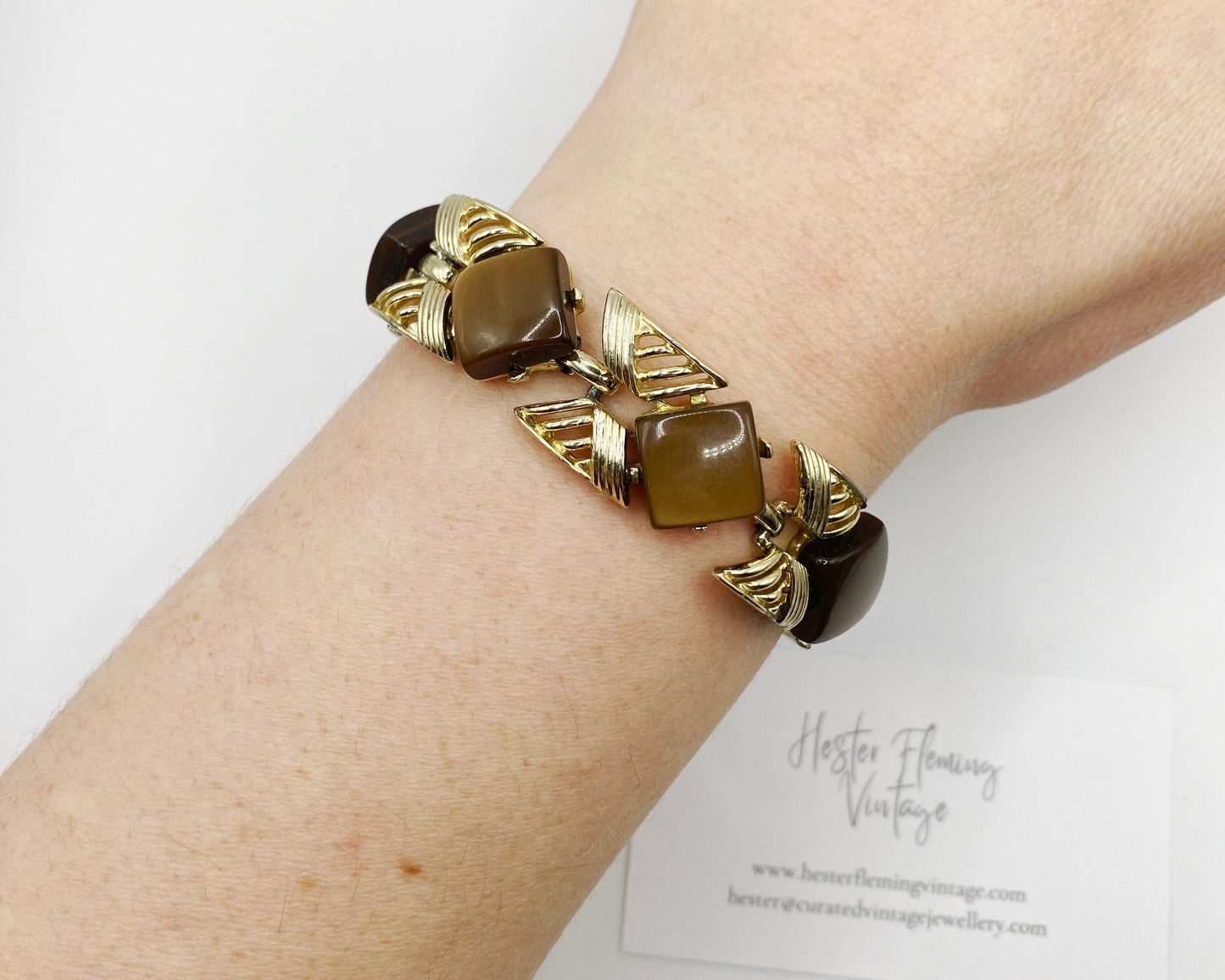 A 1950s Coro costume bracelet on wrist.