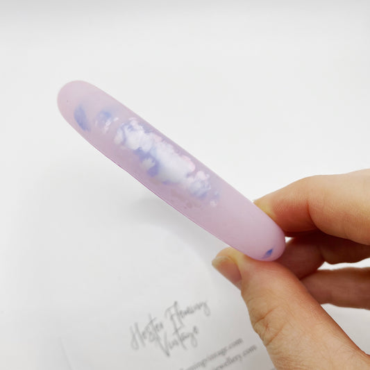 Close up shot of the vintage 80s pink polymer bangle.