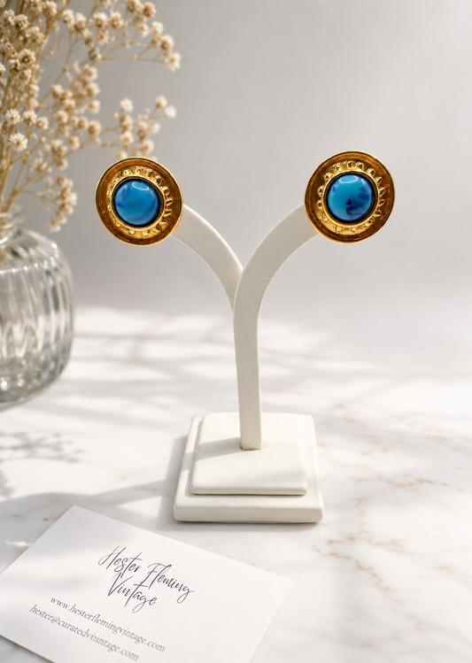 1980s Vintage Athena Earrings, presented on an earring stand.