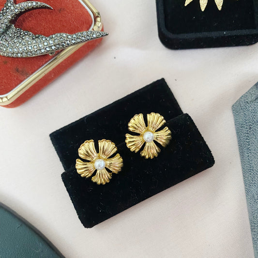 Front view of vintage 1990s Frayer earrings with faux pearl centre and 22kt gold plating for pierced ears.