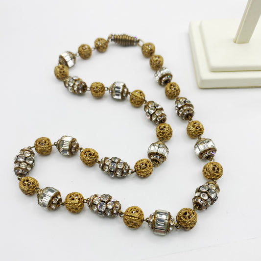 Flat lay shot of vintage french louis rousselet necklace.