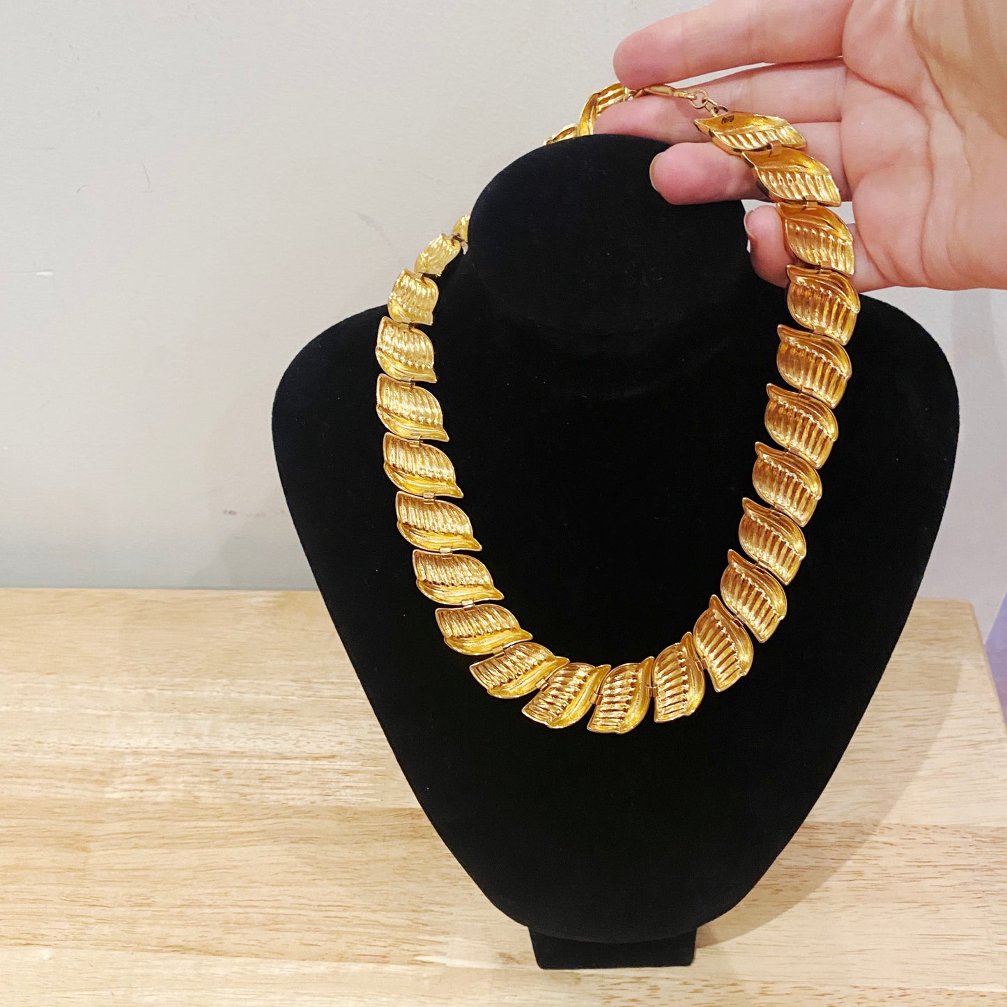 Back view of adjustable vintage Napier necklace, 1970s retro goldtone statement jewelry piece.