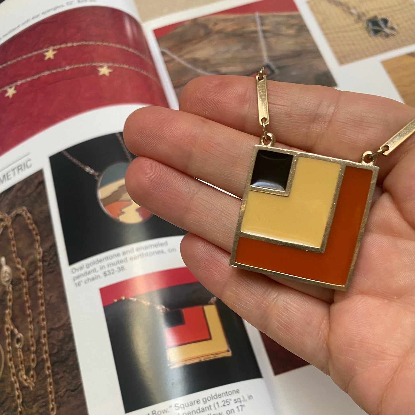 Collectible retro Sarah Coventry necklace, 3cm goldtone enamel square pendant with chain. Book reference.