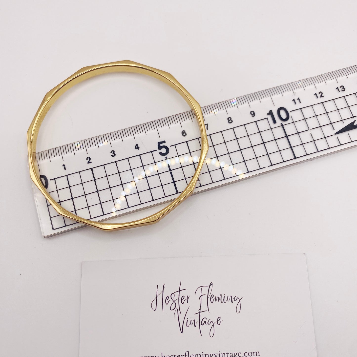 1970s Monet bangle with articulated design, perfect for layering, measurement.
