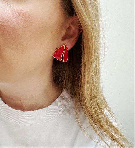 Vintage Trifari red enamel earrings worn and styled with white tee.