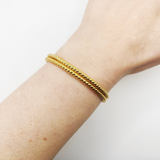 Pair of vintage gold bangles from London, ideal for small to medium wrists