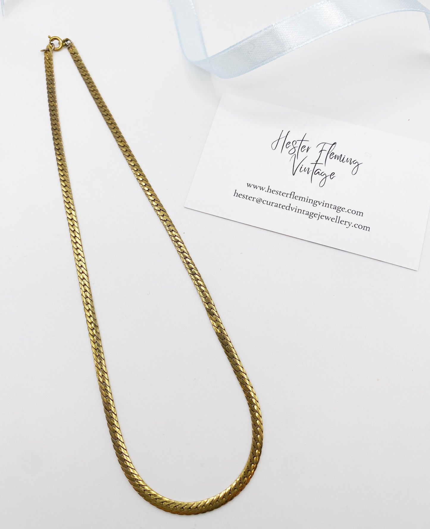 Gold chain necklace on a white background with 'Hester Fleming Vintage' branding.
