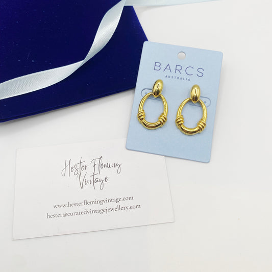 Front view of vintage 1990s Barcs gold-plated hoop earrings in excellent condition.
