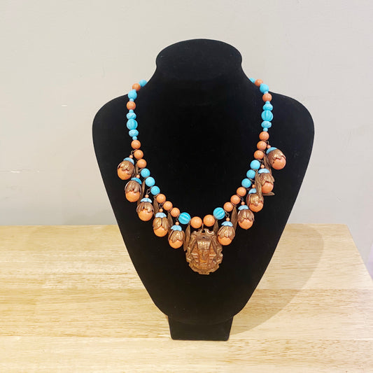 Vintage Art Deco Czech necklace featuring a detailed Pharaoh pendant and brass Egyptian motifs.