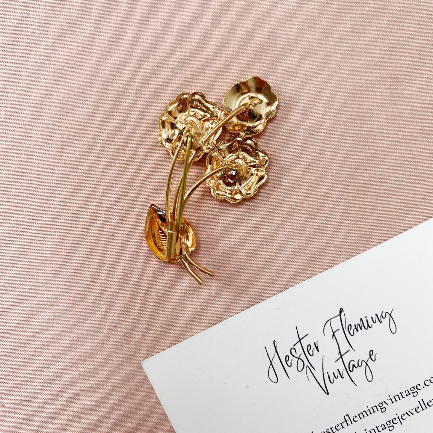 Unworn 1940s French vintage floral brooch from deadstock collection, back view.