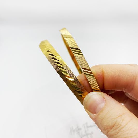 Vintage Monet bangles for medium wrist, elegant gold tone with signature craftsmanship.