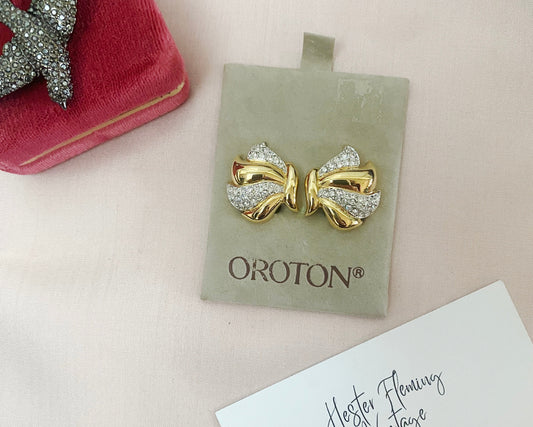 Front view of retro-style vintage earrings with Swarovski crystals and gold plating, circa late 80s to early 90s.