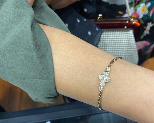 Vintage Swarovski crystal bracelet styled on wrist, 1990s gold plated design.