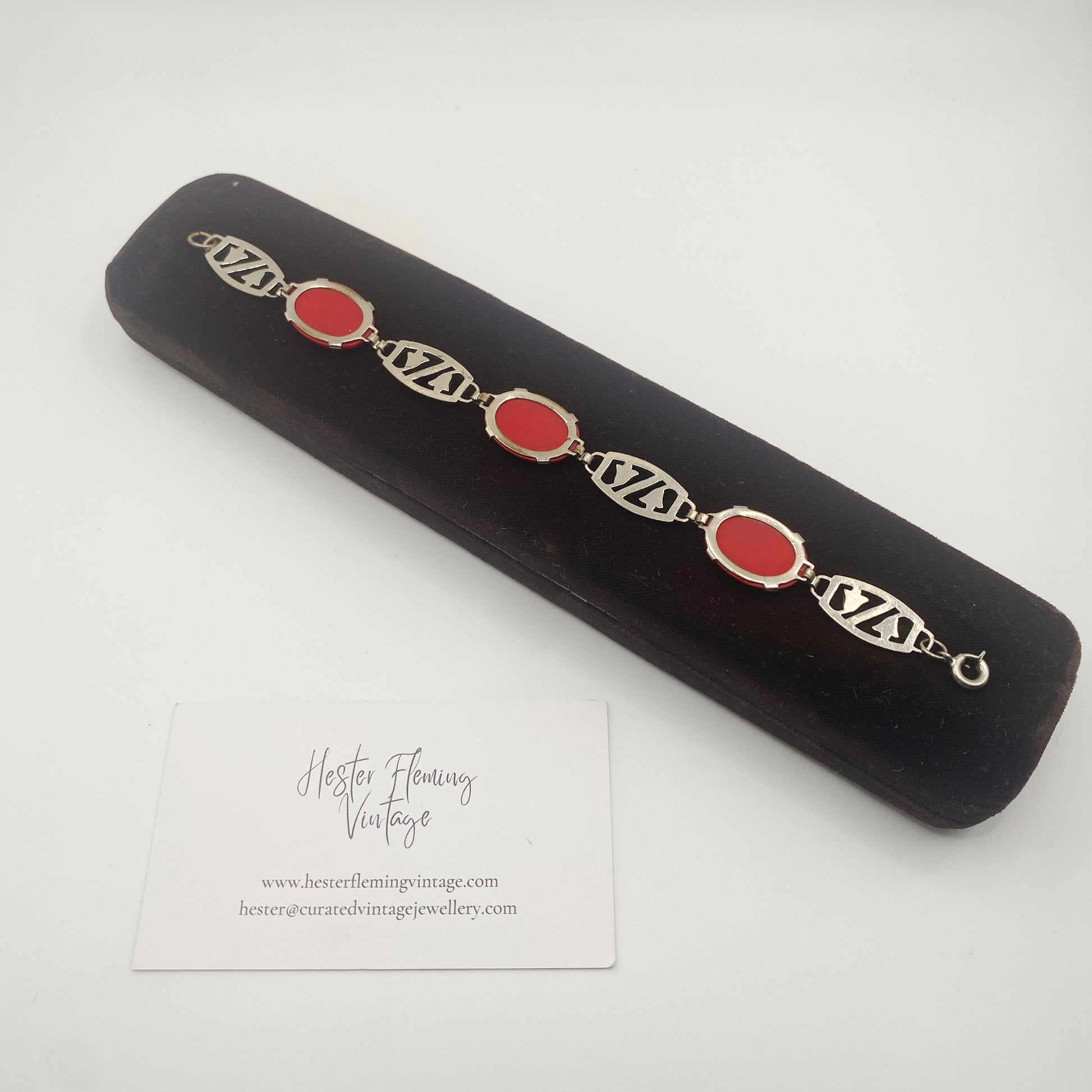 Collectible Czech red glass bracelet with enamel accents, 1940s vintage jewellery. Back view.