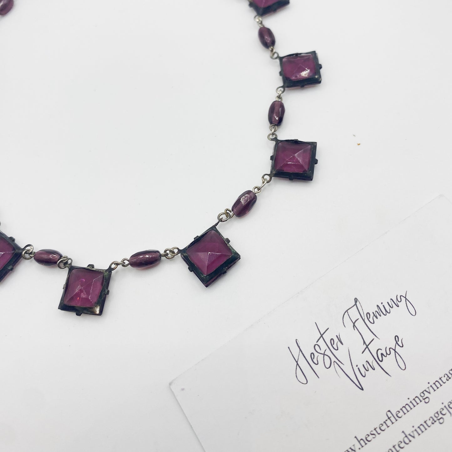1930s Czech amethyst crystal necklace laid flat showing back view.