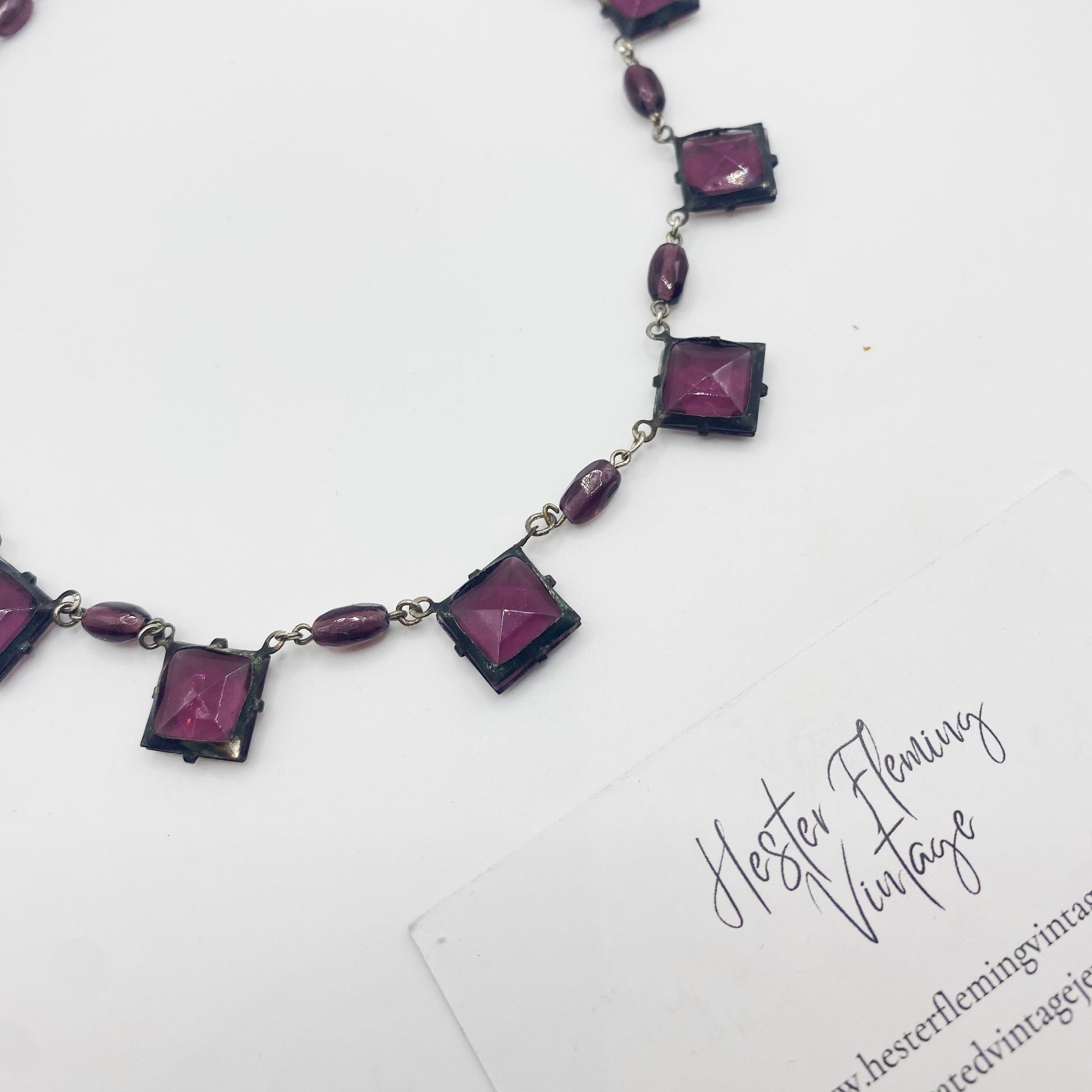 1930s Czech amethyst crystal necklace laid flat showing back view.