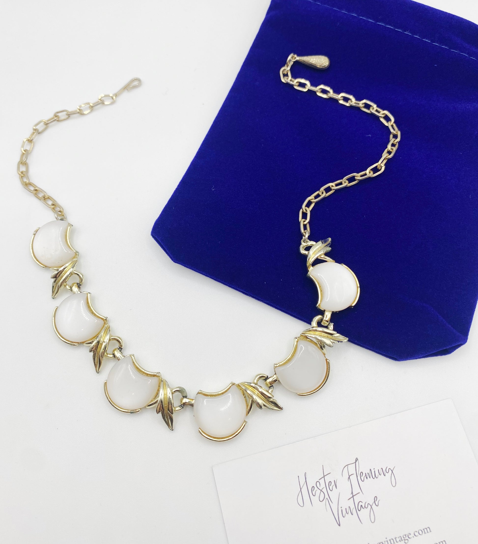 Vintage 1940s Coro Necklace Flatlay with HFV pouch and card.