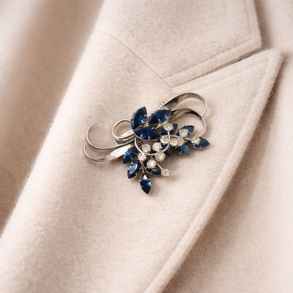 1940s Jewelcrest brooch styled on a cashmere jacket.