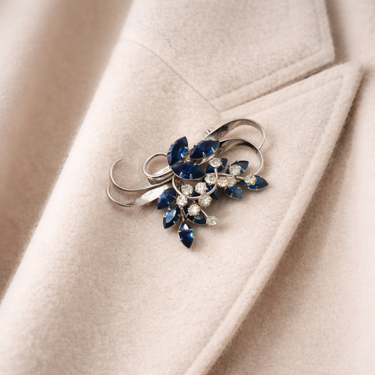1940s Jewelcrest brooch styled on a cashmere jacket.