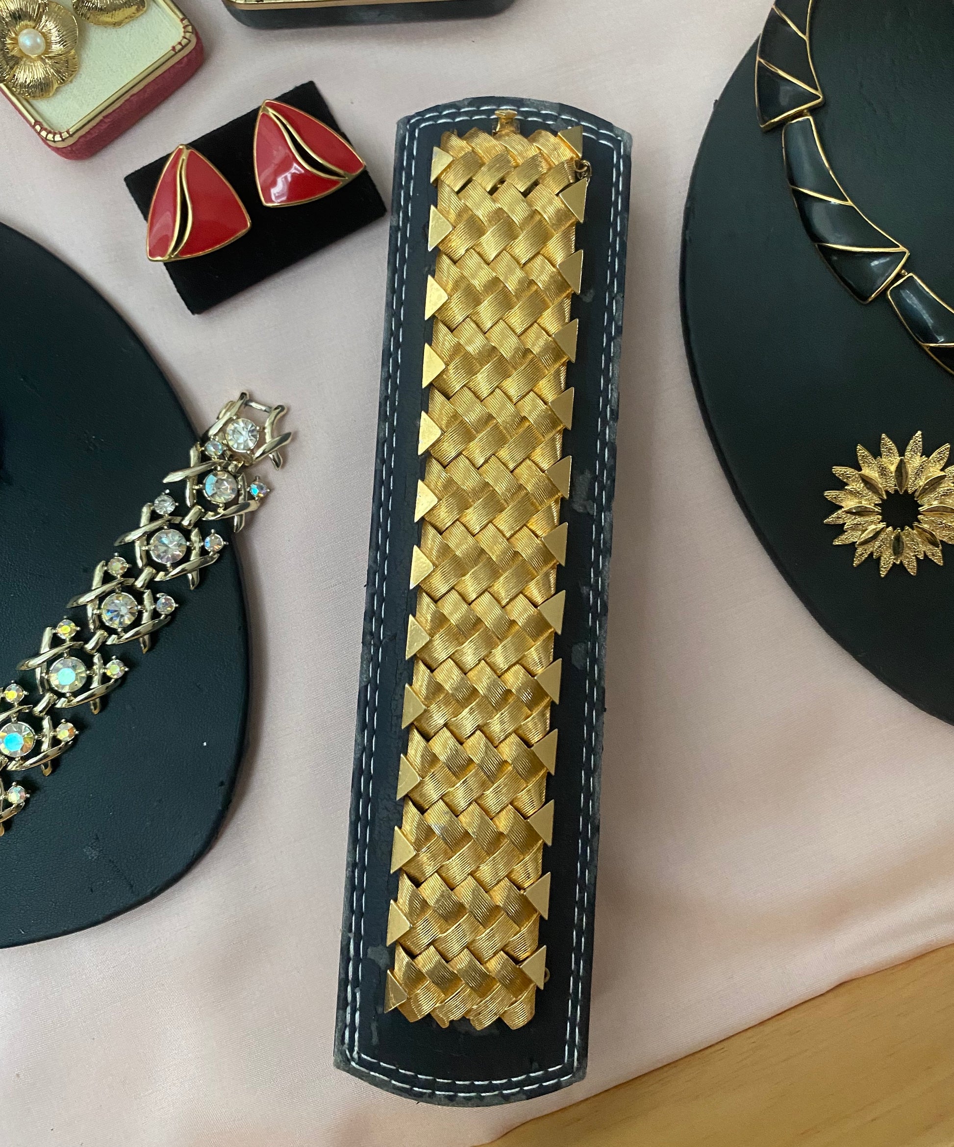 Front view of 1950s vintage Boucher gold-tone cuff bracelet with basketweave texture