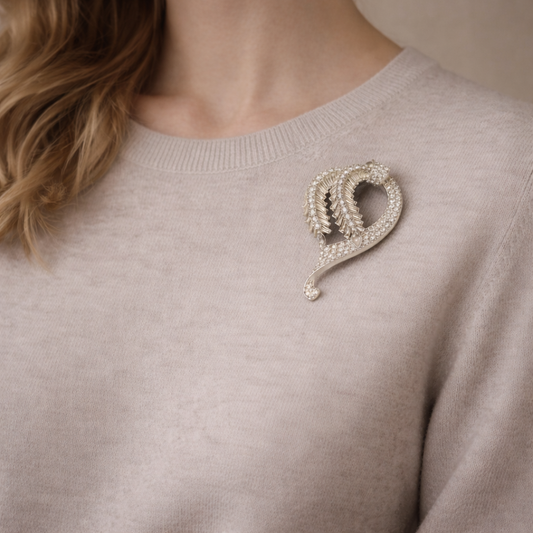 Vintage 1950s Pennino Brooch styled on a cream knit.