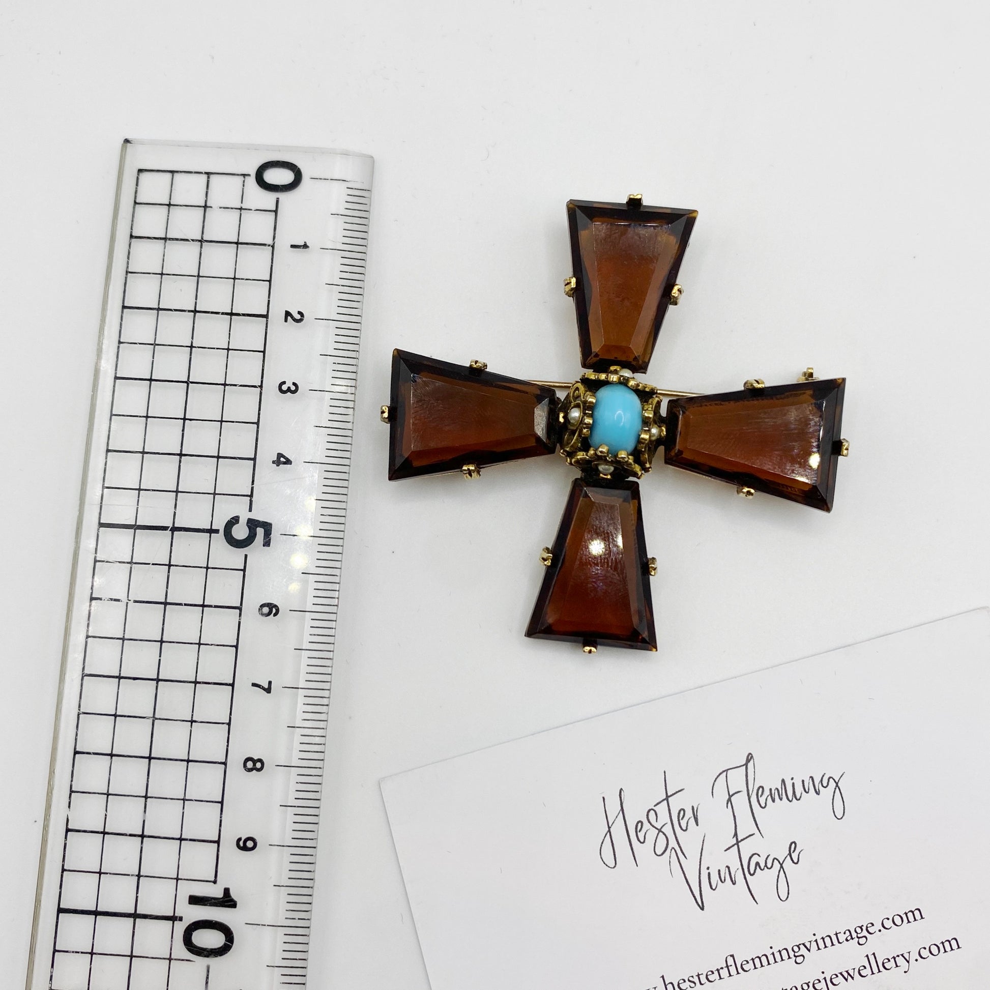 Sizing reference showing 6cm vintage Accessocraft NYC Maltese Cross brooch