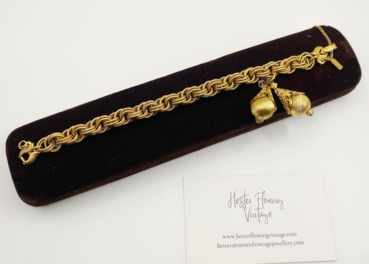 1960s Monet Bolero Bracelet in textured goldtone, signed and collectible vintage designer piece.