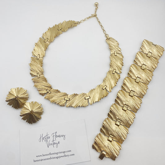 1960s Trifari gold-tone demi-parure set with necklace, bracelet and clip-on earrings