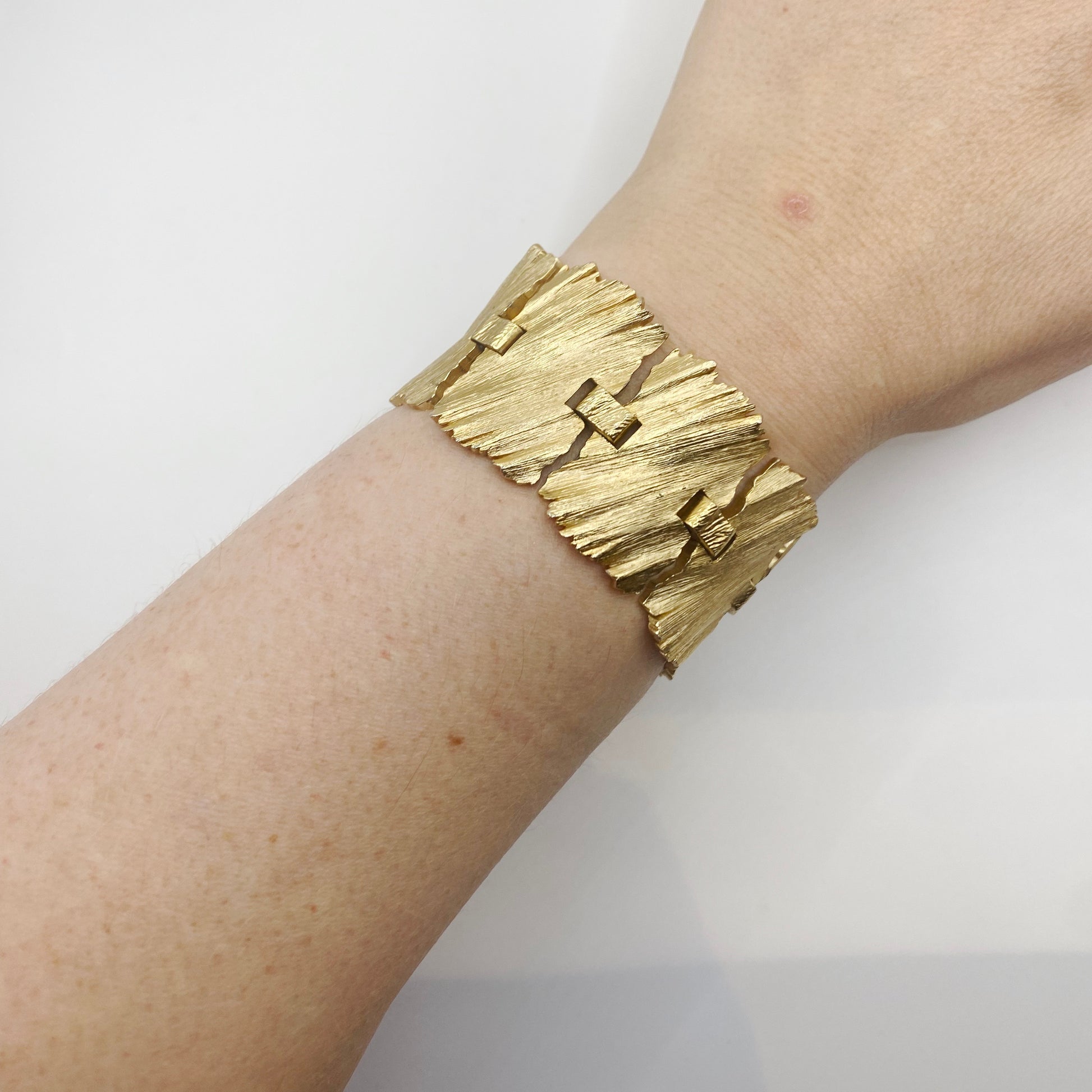 Vintage 1960s Trifari textured gilt metal cuff bracelet.