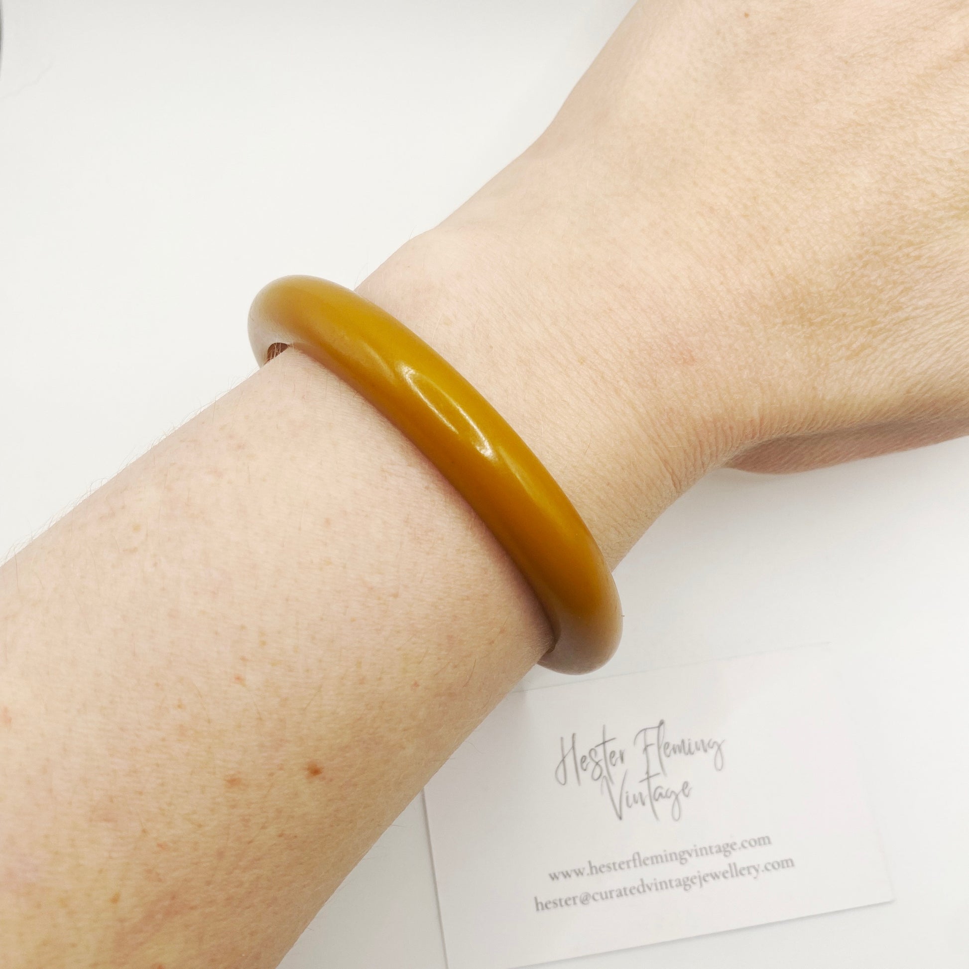 1960s vintage Bakelite bangle worn on wrist for scale
