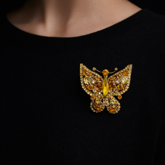 1960s Juliana DE Brooch styled on a fine black knit.