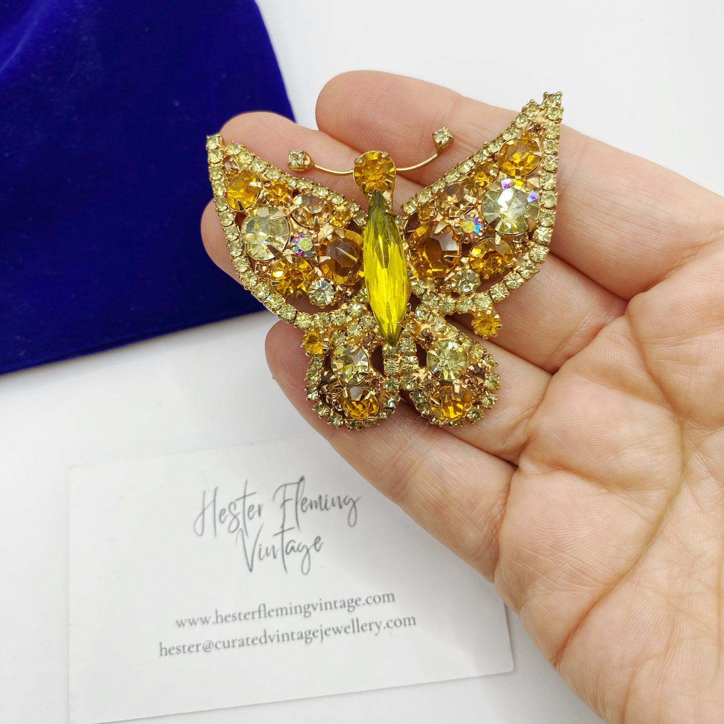 1960s Juliana DE Butterfly brooch placed in hand for scale. 