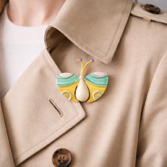 1960s Original by Robert butterfly brooch styled on a trench coat. 