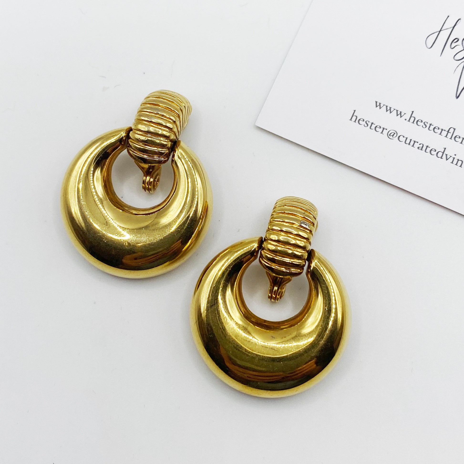 High polished gilt earrings by Monet. Comfortable clip-on range.