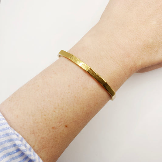 Vintage 1970s Monet articulated bangle in gold tone, mid-century costume jewellery
