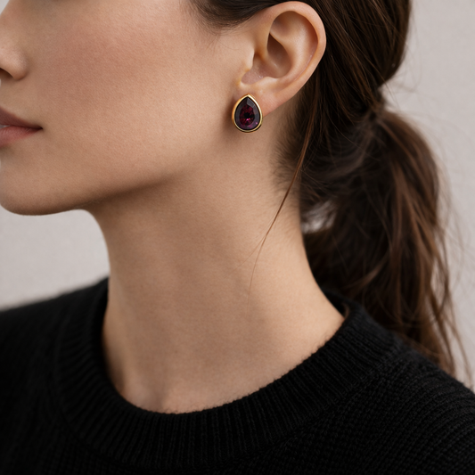 1970s Christian Dior Earrings, styled on a model wearing a black knit. 