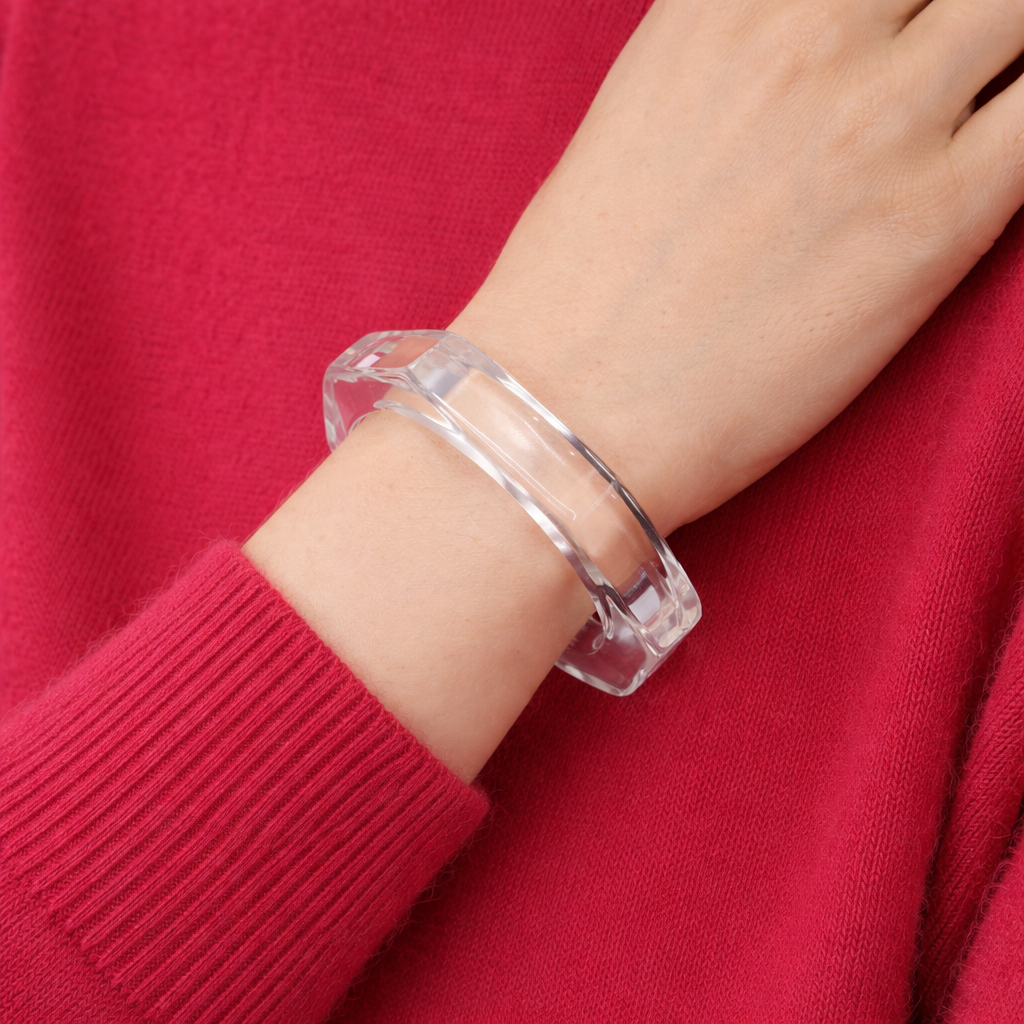 1970s Lucite bangle styled on a vibrant red jumper. 