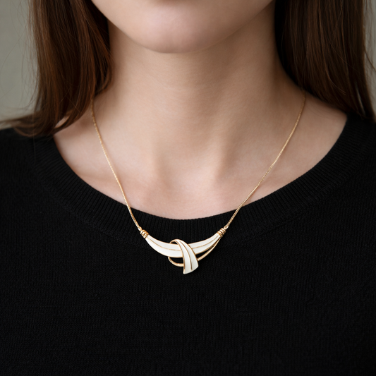 1970s Trifari Necklace, styled with a fine black knit. 