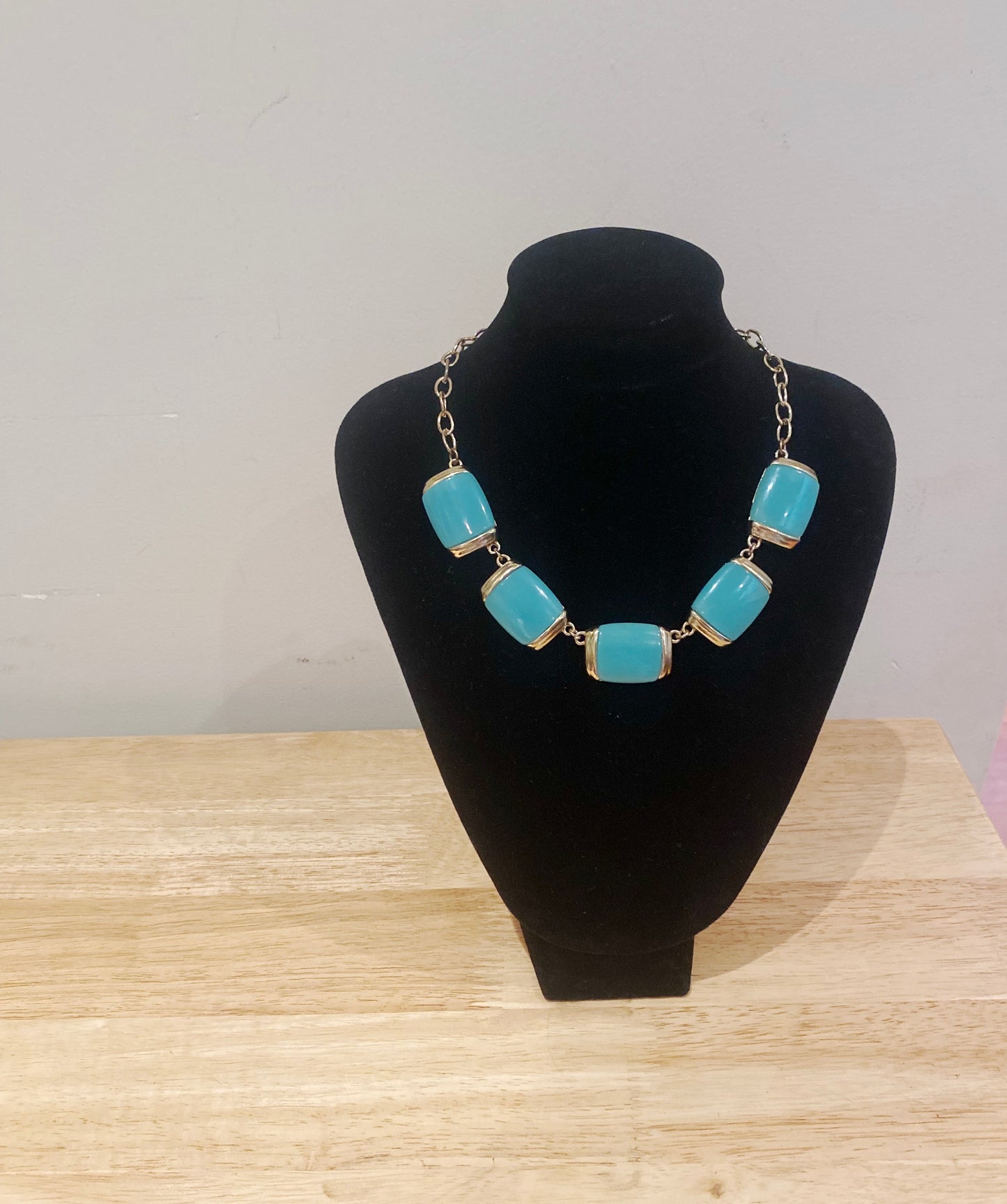 1980s Crown Trifari necklace styled on neck display, jade green glass statement design