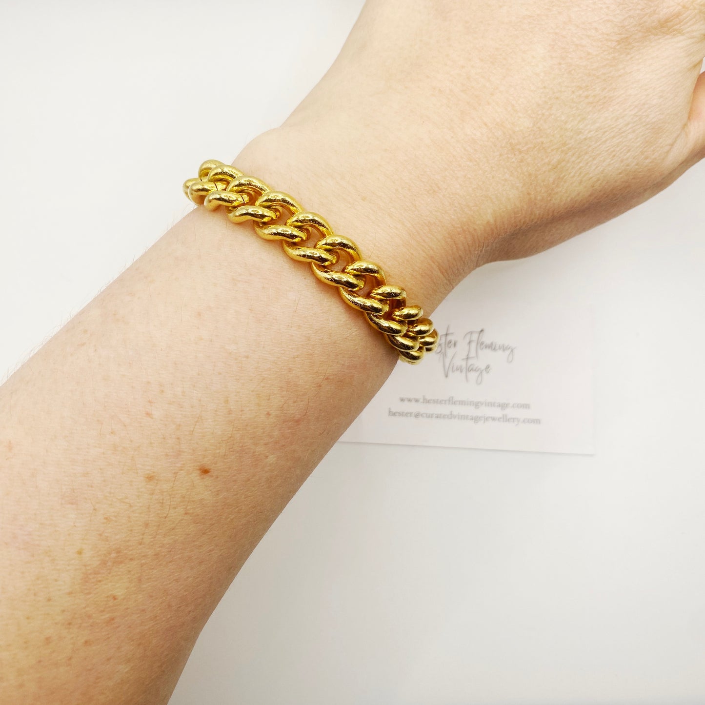 1980s 22K gold plated chunky curb chain bracelet on model. 